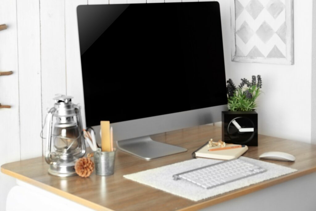A desk with a computer set
