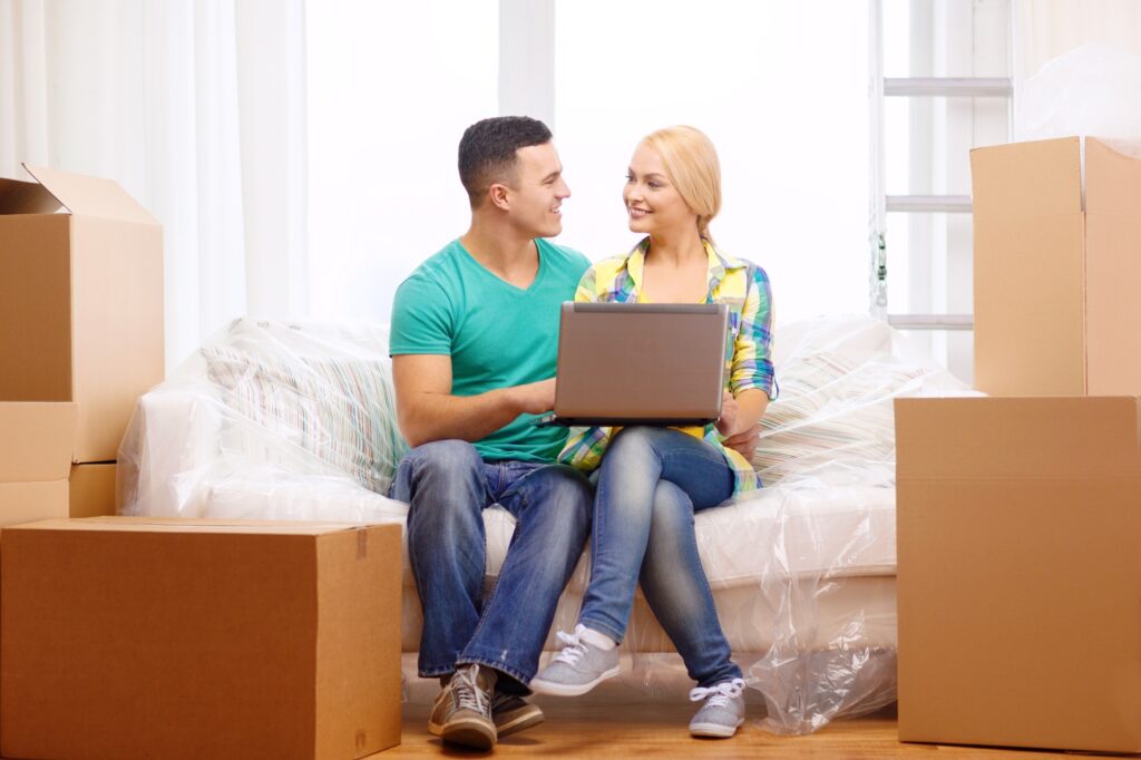 A couple taking a break from packing for the move